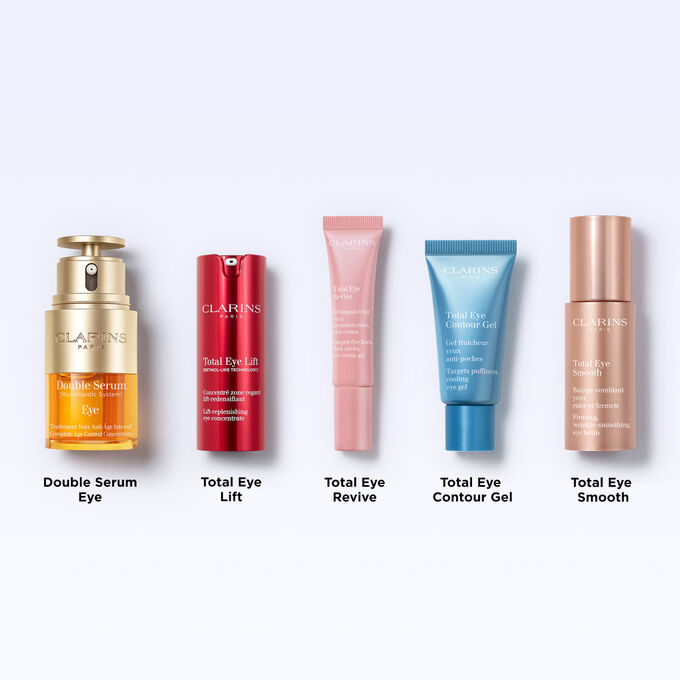 Clarins Total Eye Contour Gel tuubi ja kahvipapuja, tuotteen koostumuksessa on luonnollisia ainesosia.