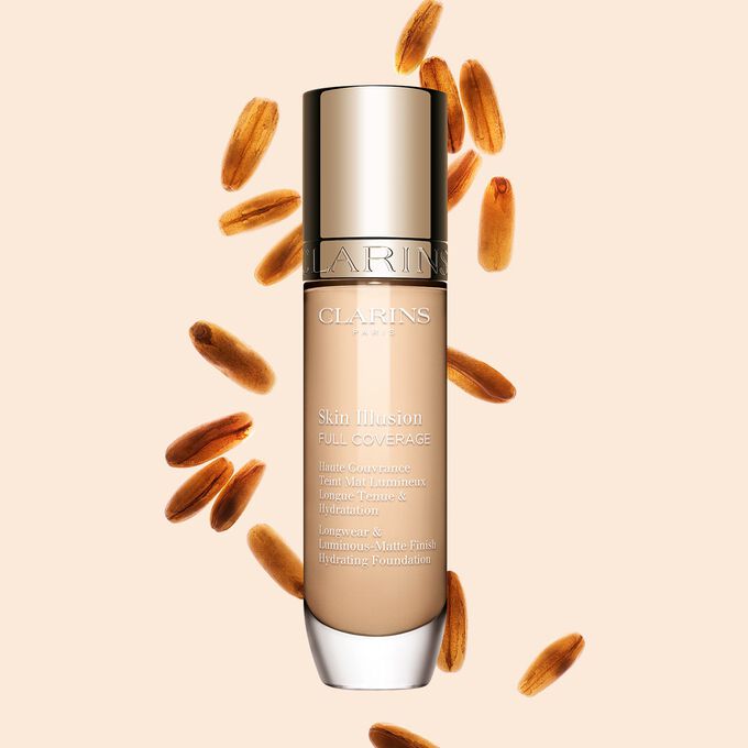 Clarins Skin Illusion Full Coverage, joka esittelee tyylikk&auml;&auml;n muotoilunsa ja n&auml;ytt&auml;v&auml;n pakkauksensa &ndash; t&auml;ydellinen meikkivoide virheett&ouml;m&auml;&auml;n ja luonnolliseen ihons&auml;vyyn.