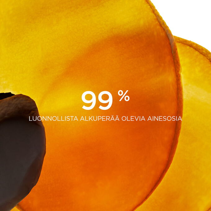 L&auml;hikuva villimangon viipaleista, joka korostaa ett&auml; 99 % Clarins Comfort Scrub -tuotteen ainesosista on luonnollista alkuper&auml;&auml;.