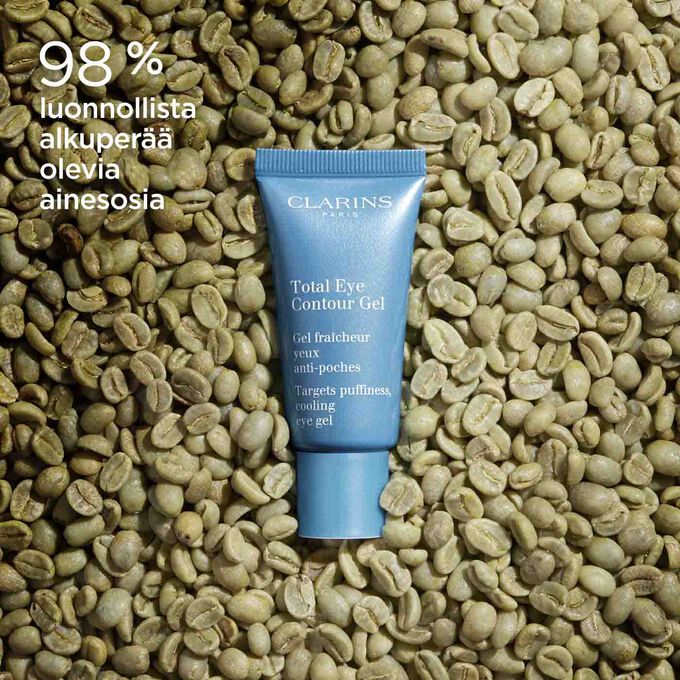 Clarins Total Eye Contour Gel tuubi ja kahvipapuja, tuotteen koostumuksessa on luonnollisia ainesosia.