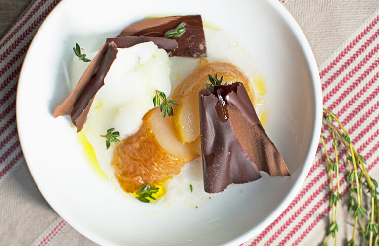 Poached pear, lemon-thyme sorbet, and chocolate shavings